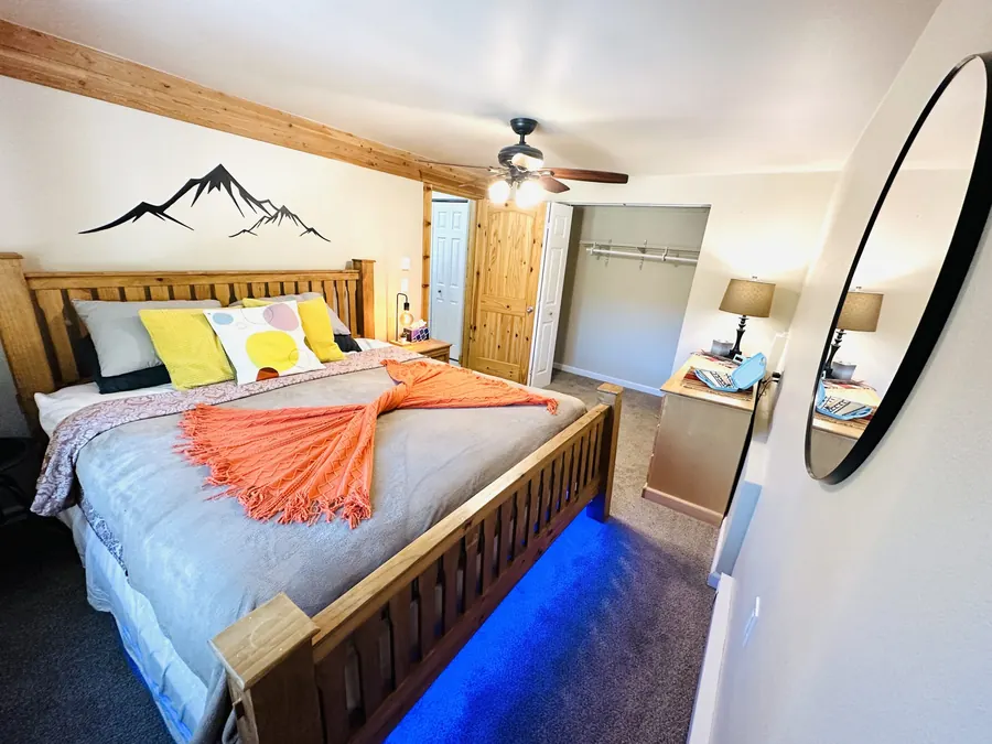 Bedroom with mountain artwork