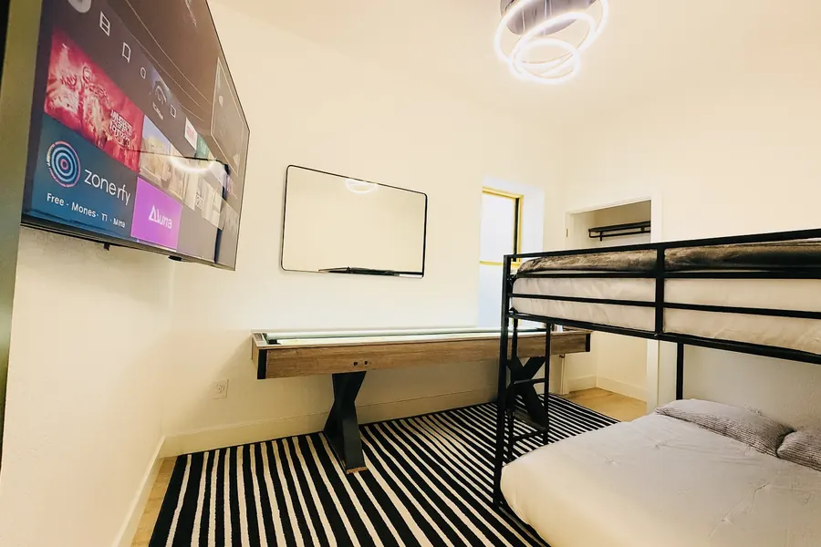 Bunk beds with mounted TV