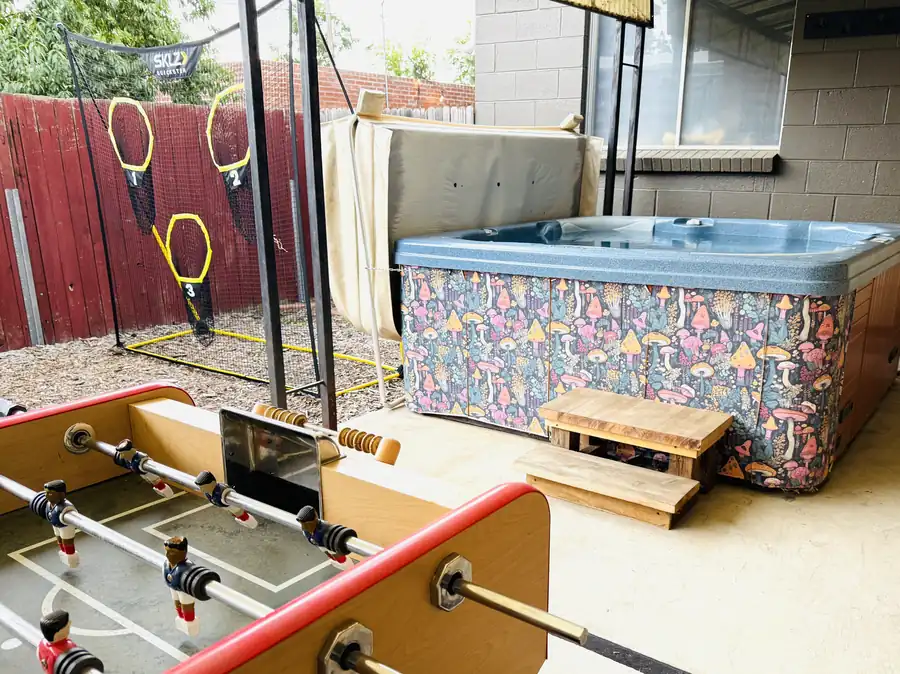 Hot tub next to the foosball table