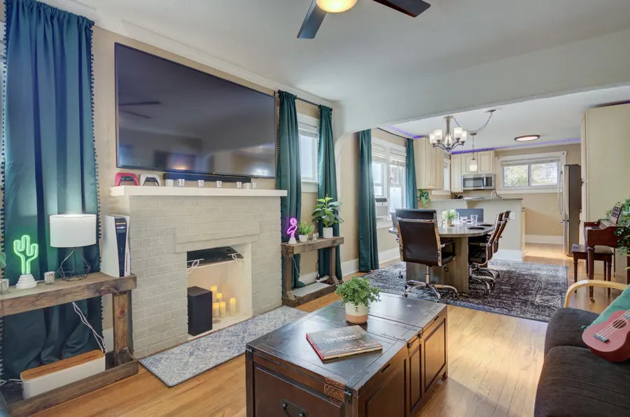 Living room with fireplace and teal curtains